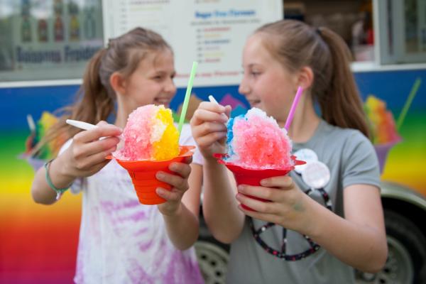 TWO GIRLS HOLD ITALIAN ICE