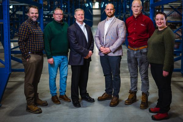 PEOPLE STAND IN A CIRCLE