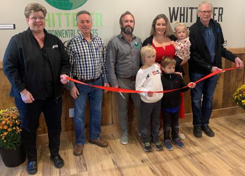 A ribbon is cut at the grand opening of Whitteker Storage Inc.