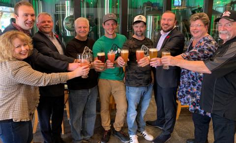 Elected officials and ownership celebrates the grand opening of Lost Villages Brewery.