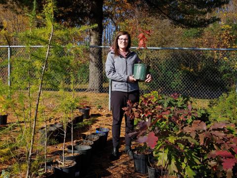 RRCA Stewardship Coordinator, Jessica Herrington, with some of the species offered through the Conservation Authority's new over-the-counter tree program.