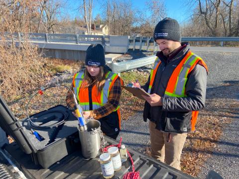 RRCA staff record data from a Raisin River water sample taken from a survey site in South Stormont.